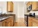 Well-equipped kitchen with granite countertops and wood cabinets at 355 E Ohio E St # 324, Indianapolis, IN 46204