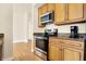 Stainless steel appliances and light wood cabinets in this kitchen at 355 E Ohio E St # 324, Indianapolis, IN 46204