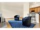 Living area with hardwood floors and kitchen bar at 355 E Ohio E St # 324, Indianapolis, IN 46204