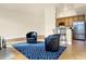 Open living room with hardwood floors and kitchen bar at 355 E Ohio E St # 324, Indianapolis, IN 46204