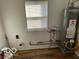 Laundry room with new Rheem gas water heater at 908 W Main St, Greenfield, IN 46140