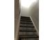 Carpeted staircase leading to the upper level at 3682 Newgate Ln, Indianapolis, IN 46235