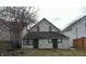 Back of house showing two entries and small yard at 604 Lincoln St, Indianapolis, IN 46203