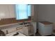 Kitchen with white cabinets, appliances, and double sink at 604 Lincoln St, Indianapolis, IN 46203