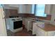 Kitchen with white cabinets, appliances, and double sink at 604 Lincoln St, Indianapolis, IN 46203