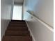 Brown carpeted staircase leading to the upper level at 604 Lincoln St, Indianapolis, IN 46203