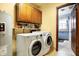 Laundry room with washer, dryer, and extra storage at 6277 E 169Th St, Noblesville, IN 46062