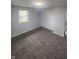 Bright bedroom featuring new carpet and updated closet at 6805 E County Road 100 S, Avon, IN 46123