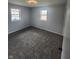 Well-lit bedroom with new carpet and large window at 6805 E County Road 100 S, Avon, IN 46123