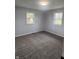 Spacious bedroom with new carpet and fresh paint at 6805 E County Road 100 S, Avon, IN 46123