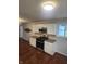 Kitchen with white cabinets, granite counters, and stainless steel appliances at 6805 E County Road 100 S, Avon, IN 46123