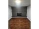 Living room with brick fireplace and dark hardwood floors at 6805 E County Road 100 S, Avon, IN 46123
