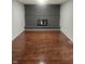 Living room with brick fireplace and dark hardwood floors at 6805 E County Road 100 S, Avon, IN 46123