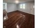 Bright and airy living room with hardwood floors and neutral walls at 6805 E County Road 100 S, Avon, IN 46123