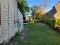 Spacious backyard with grassy area and alley access at 2520 Winthrop Ave, Indianapolis, IN 46205