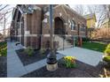 Front entry with steps, landscaping, and a lamp post at 749 N Park Ave # A, Indianapolis, IN 46202