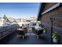 Virtually staged rooftop deck with seating and plants at 749 N Park Ave # A, Indianapolis, IN 46202