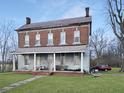 Brick two-story home with front porch needing renovation at 11772 W Belle Union Rd, Stilesville, IN 46180