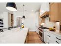 Modern kitchen with marble countertops, stainless steel appliances, and ample cabinetry at 41 N Rangeline Rd # 2, Carmel, IN 46032