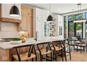 Modern kitchen with island, light wood cabinets, and black accents at 41 N Rangeline Rd # 2, Carmel, IN 46032