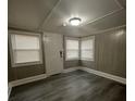 Bright and airy front room with new flooring and blinds at 815 W 22Nd St, Anderson, IN 46016