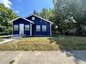 Charming blue house with fresh landscaping at 815 W 22Nd St, Anderson, IN 46016
