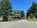 Ranch-style home with carport and well-maintained lawn at 643 Pratt St, Greenfield, IN 46140