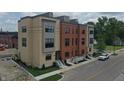 Aerial view of new townhomes with red and tan brick exteriors, street parking at 178 S Water # F, Franklin, IN 46131