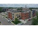 Aerial perspective of townhouses, showcasing rooftop decks and surrounding landscape at 178 S Water # F, Franklin, IN 46131