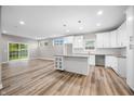 Modern kitchen with white cabinets, granite counters, and island at 3368 Johns Way, Greenwood, IN 46143