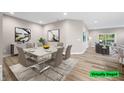 Bright dining room with modern table and chairs at 3368 Johns Way, Greenwood, IN 46143