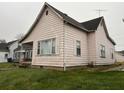 Side view of a charming home with yard at 921 W Neely Ave, Muncie, IN 47303