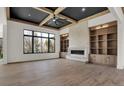 Spacious living room with built-in shelving, fireplace, and high ceilings at 9280 Highpointe Ln, Zionsville, IN 46077
