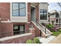 Modern brick townhouse exterior with a concrete staircase at 721 E 16Th St, Indianapolis, IN 46202