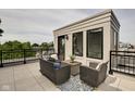 Private rooftop deck with seating area and city views at 721 E 16Th St, Indianapolis, IN 46202
