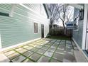 Charming backyard patio with a modern square tile design and a grassy area at 2133 N Talbott St, Indianapolis, IN 46202