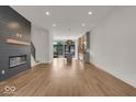 Open concept living room with kitchen and fireplace at 671 E 16Th St, Indianapolis, IN 46202