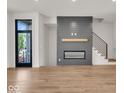 Modern gas fireplace with a gray shiplap wall at 671 E 16Th St, Indianapolis, IN 46202
