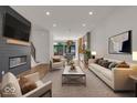 Open living area with fireplace, hardwood floors, and modern furniture at 671 E 16Th St, Indianapolis, IN 46202