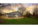 Newly built home with a spacious backyard and wooden fence at 6233 Lafayette Rd, Indianapolis, IN 46278
