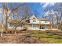 Two story home with wrap around porch and mature trees at 7481 N County Road 550 E, Pittsboro, IN 46167