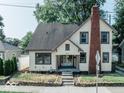 Two-story home with front yard and steps leading to the entrance at 819 E 49Th St, Indianapolis, IN 46205