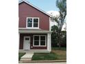 Red two-story duplex with white door and trim at 217 N Temple Ave, Indianapolis, IN 46201