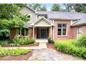 Two-story home with stone walkway and landscaping at 8801 Traders Lndg, Brownsburg, IN 46112