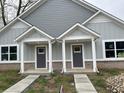 Gray duplex with front porches and walkways at 863 E Harrison St, Martinsville, IN 46151