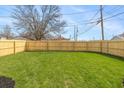 Large, fenced backyard with lush green grass at 421 S Randolph St, Indianapolis, IN 46201