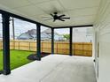 Covered patio with concrete flooring, backyard view, and wooden fence at 421 S Randolph St, Indianapolis, IN 46201