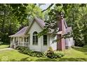 House with wrap around porch, nestled in woods at 5722 Slippery Elm Shoot Rd, Morgantown, IN 46160