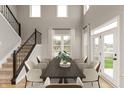Bright dining room with a large table, access to backyard, and staircase at 15287 Garden Mist Pl, Fishers, IN 46037