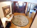 Grand entryway with hardwood floors and circular rug at 909 E 38Th St, Indianapolis, IN 46205